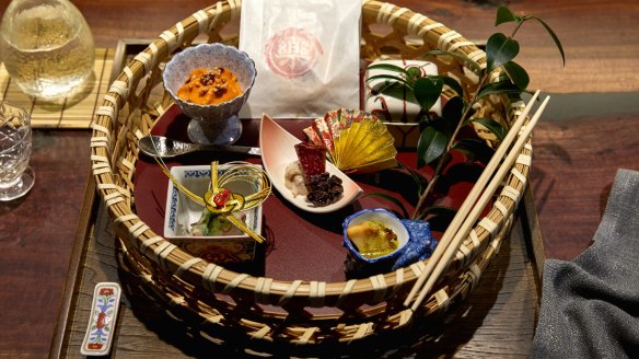 Hassun tray featuring abalone, capsicum mousse, wagyu bresaola, pickled octopus and gently fried Murray cod marinated in vinegar. 