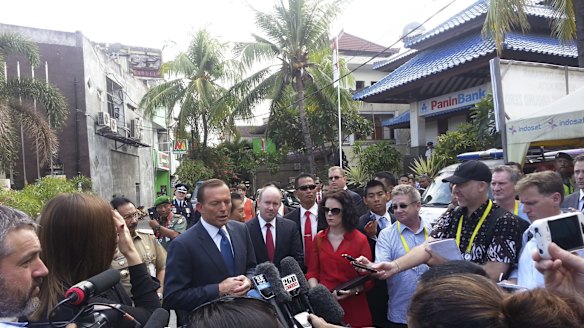 Michael Bachelard doorstopping Prime Minister Tony Abbott at the Bali bomb memorial during an APEC summit in 2013.
