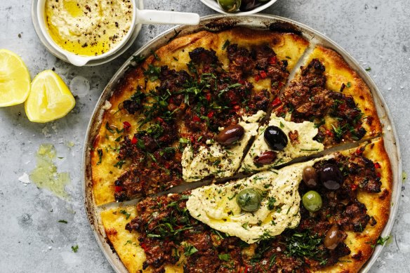 Lahmacun with hummus and olives.