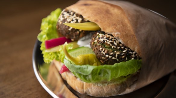 A two-hander of pocket bread stuffed with crunchy falafel, lettuce, pickles and cucumber. 