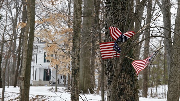 Small American flags fly in front of the Warmbier family home in Wyoming, Ohio, after Otto Warmbier's detention.  