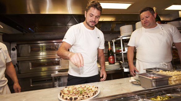 Baby Pizza is showing the tennis in its courtyard and serving a pizza inspired by Swiss player Stan Wawrinka (left).