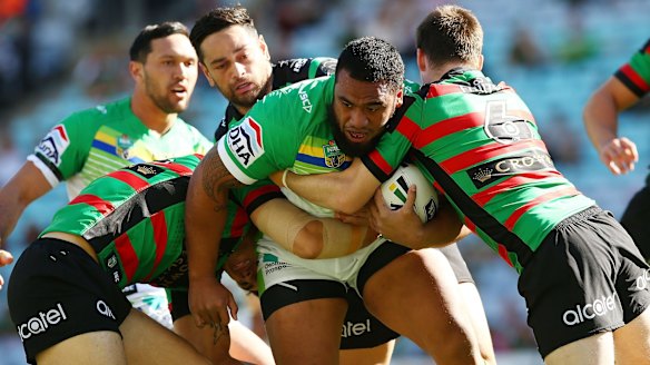 Mid-season acquisition: Ex-Eels prop Junior Paulo is tackled during the round 21 NRL match between the South Sydney Rabbitohs and the Canberra Raiders.