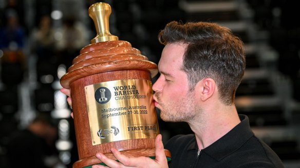 Tamp champ: Anthony Douglas with his World Barista Championship trophy.