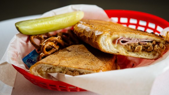 Mason Dixon's porky cubano, served with a pickle spear and pretzels.