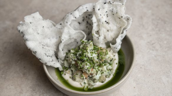 Spanner crab and avocado with puffed sesame rice crackers.

