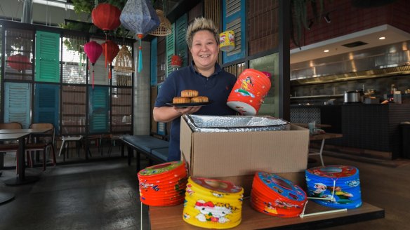 Chef Jerry Mai packaging special Mid-Autumn Festival food and paper lanterns at her Vietnamese beer hall Bia Hoi. 
