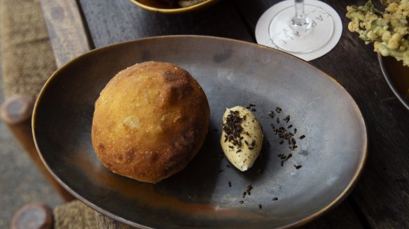 Warm damper bread with wattleseed butter.