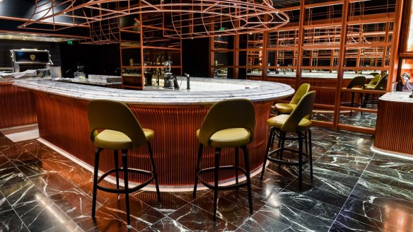 The horseshoe-shaped marble-topped bar at Victor Churchill in Armadale.