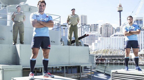 Tribute: Nadia McCulloch, Nick Phipps, Andrew McCulloch and Dave Dennis on  HMAS Vampire on Wednesday.