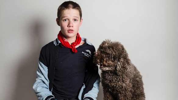 16-year-old Logan with his therapy dog Simi.