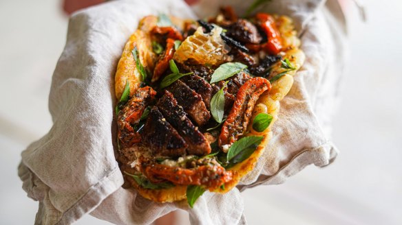 Flatbread piled with coffee spice-rubbed lamb, honey and feta and optional fresh honeycomb.