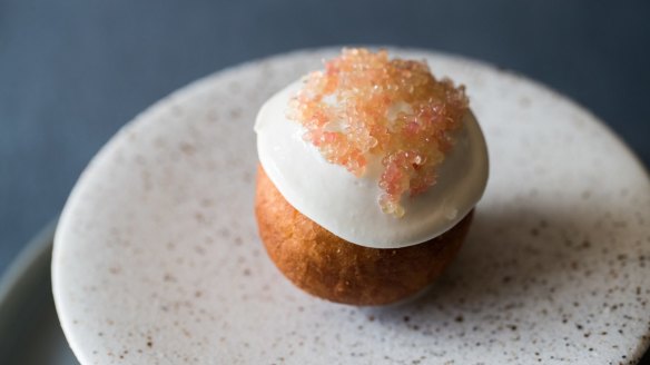 Potato doughnut, black pudding, marrow and finger limes.