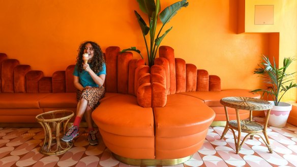 Kenny Lover's retro orange velvet lounge and cane tables are a far cry from the usual wipe-clean ice-cream parlour furniture.