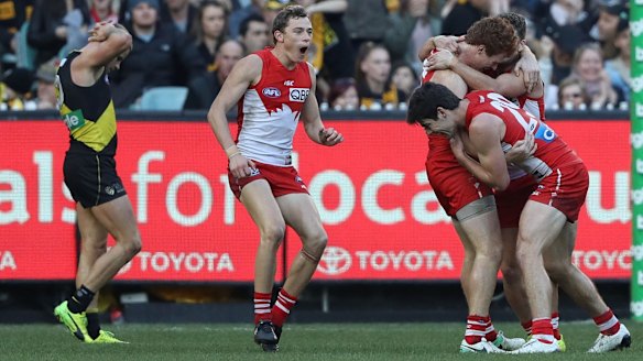 The Swans converge on Gary Rohan after he sealed the win against Richmond at the MCG.