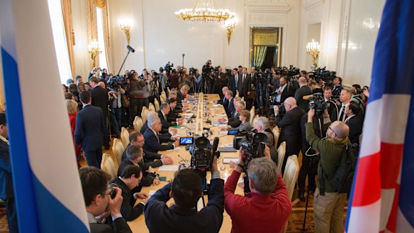 Media surround a table as US Secretary of State Rex Tillerson and Russian Foreign Minister Sergey Lavrov talk in Moscow, Russia, on Wednesday.
