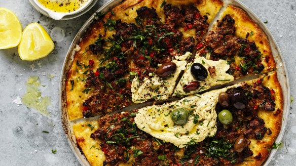 Lahmacun with hummus and olives.