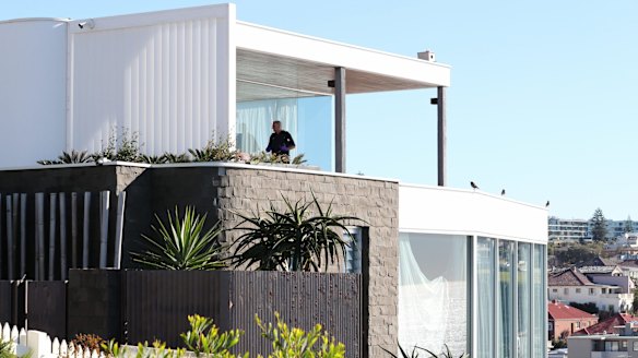 Police search John Ibrahim's Dover Heights home in Sydney.