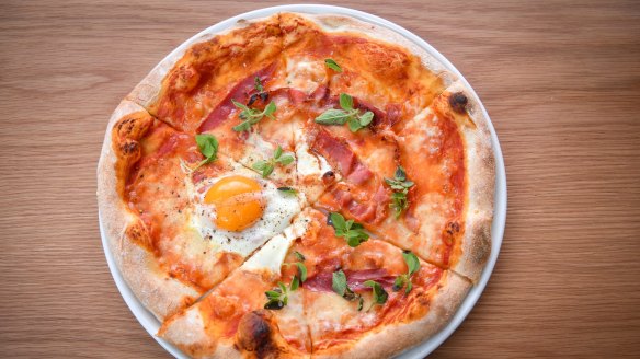 Pancetta and egg pizza, on a chewy base. 