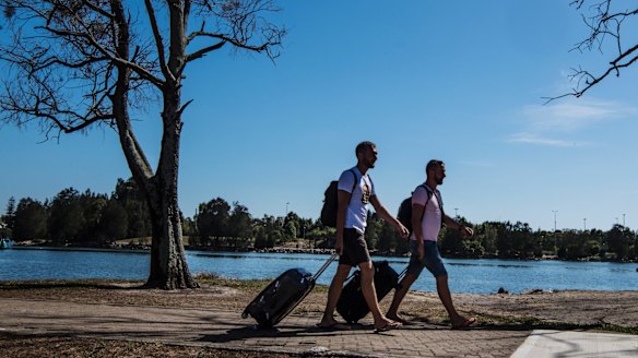 Polish tourists Tom and Andrew walking from Wolli Creek station to Sydney Airport.