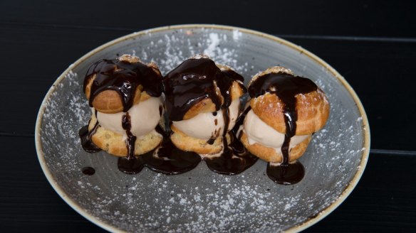 Profiteroles with chocolate sauce. 