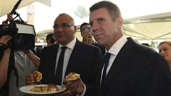 Former premier Mike Baird on the 2015 campaign trail in Auburn with the party's candidate Ronney Oueik, a former Auburn councillor.