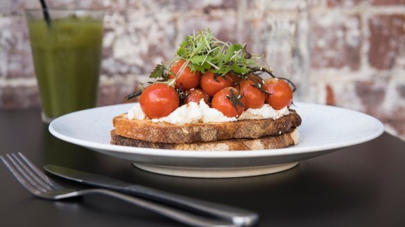 Roast cherry tomato and goats cheese with dukkah on sourdough at Tucker. 
