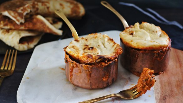 Butter chicken pot pies with naan lids.