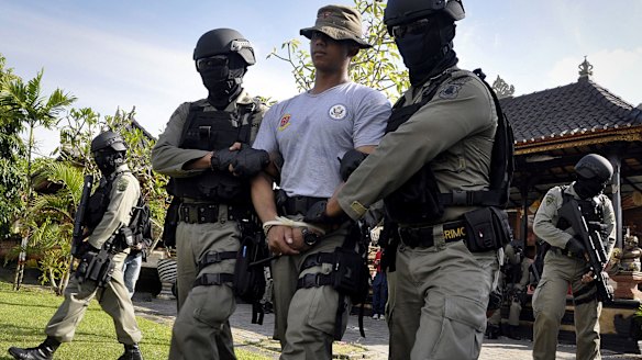 Indonesian police commandos carry out a rehearsal of a prisoner transfer in Denpasar.