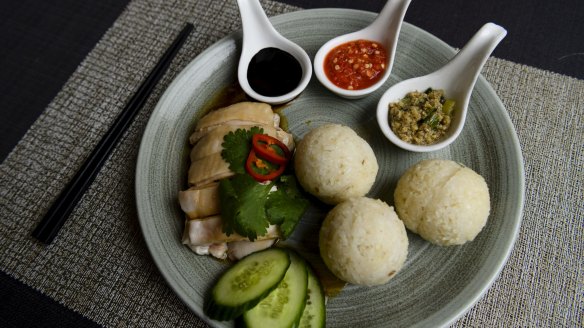 Hainan chicken accompanied with rice balls, rather than the usual plate of chicken rice.