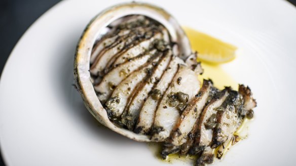 Local black-lip abalone bolstered by a compond butter of oysters, scallops and seaweed at Rockpool Bar and Grill, Sydney.