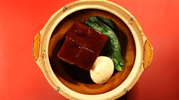 Belly pork slow-cooked in master stock and served with a soft-yolked tea egg.