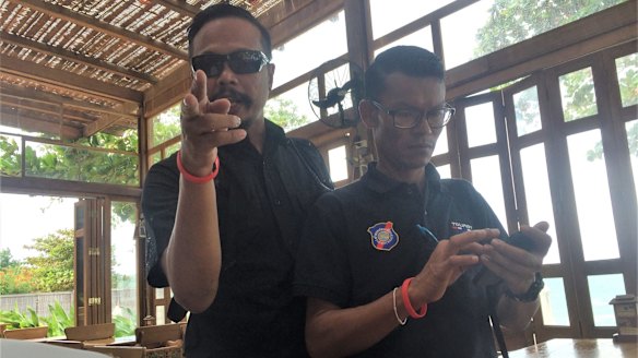 The tourist police that confiscated the paparazzi's equipment.