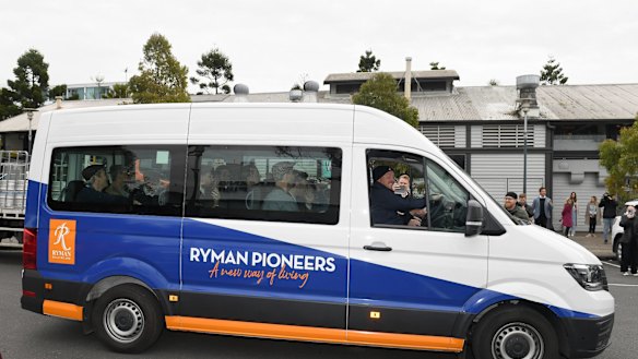 Cats players arrive on a retirement village bus for the Geelong Cats official end of AFL season celebrations at Wharf Shed