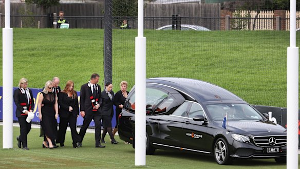 Shane Warne's children Brooke, Jackson and Summer, his parents Keith and Brigitte and brother Jason accompany his coffin on a lap of honour around the St Kilda Football Club at his private funeral. 