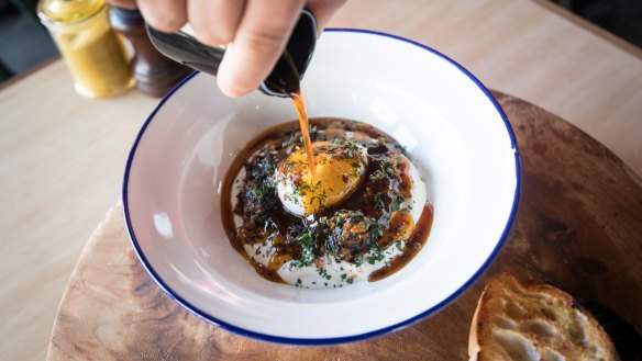 Cilbir - poached egg, yoghurt and wilted spinach with spiced burnt butter poured at the table.