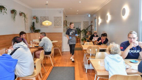Maria cafe in Upwey features pale timber seating and plenty of fresh greenery.