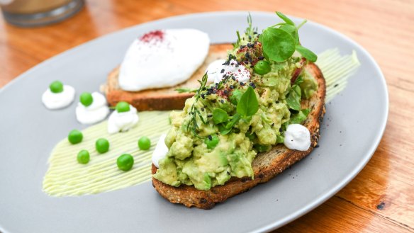 Avocado smooshed with peas and lime on sourdough.