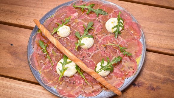 Beef carpaccio, sliced as thin as tissue paper.