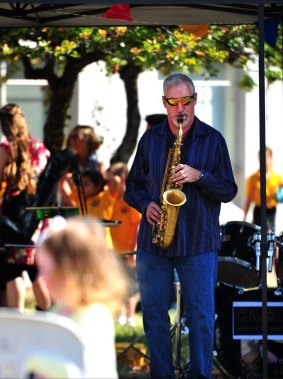 Demetri Neidorf, of Ainslie, on the saxophone at Campbell shops for Parties at the Shops.
