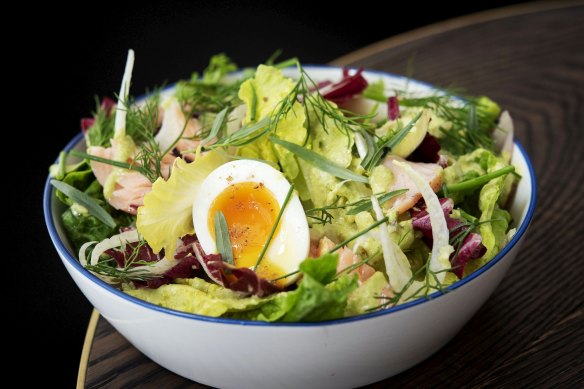 Slow-cooked salmon baby gem soft-boiled egg salad. 