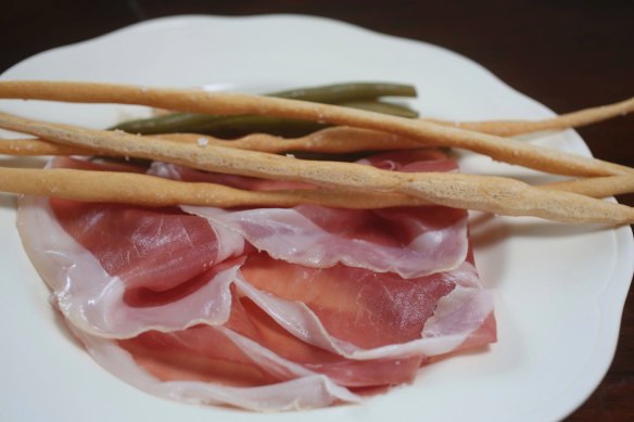 Go-to dish: Prosciutto di Parma with pickled green beans and hand-rolled grissini.