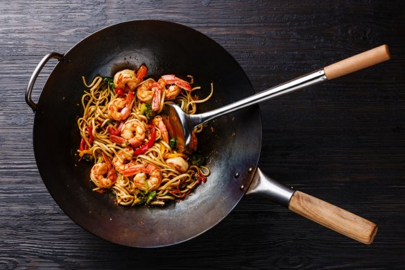 Season a cast-iron wok well and it becomes non-stick.