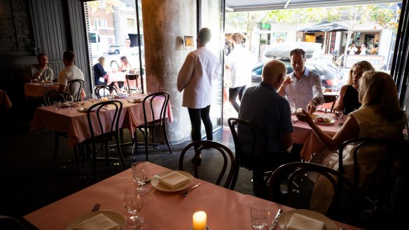 Pink tablecloths adorn the tables at Bistrot 916.