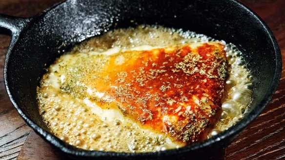 Saganaki cheese with honey and oregano at the Apollo restaurant in Sydney.