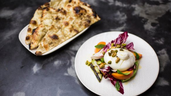 Go-to dish: Clay oven flat bread with burrata, persimmon and grilled leeks. 