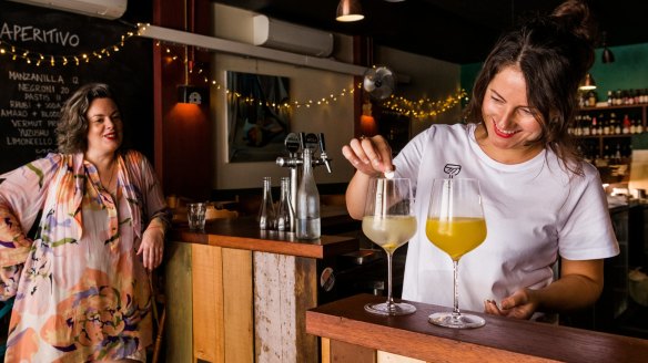 Manager Bridget Raffal (right) at Where's Nick, makes a couple of Triple Fizzes for her and Jacqueline Turner (left), sommelier of Margaret restaurant.