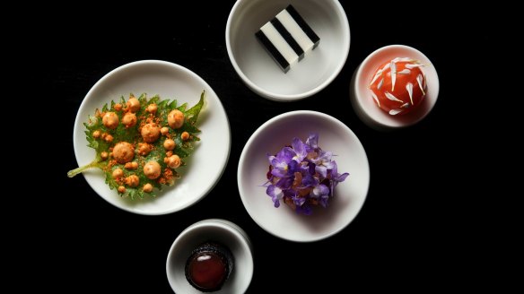 Clockwise from left: Tempura oba with smoked ama ebi (prawn); egg white tofu and smoked eggplant dashi; saikou salmon with smoked roe and sudachi (citrus); bonito, dashi cream, purple yam; tuna with yuzu kosho.