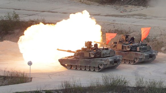 Two US Army M1 A2 tanks fire during South Korea-US joint military live-fire drills at Seungjin Fire Training Field in Pocheon, South Korea, near the border with North Korea, on Wednesday.