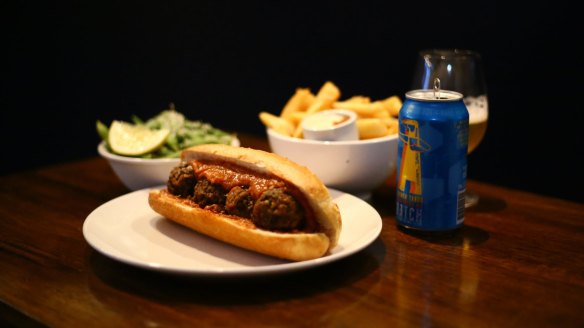 Vegan meatball sub, with greens, fries, and Batch Brewing's Tasman Tango.